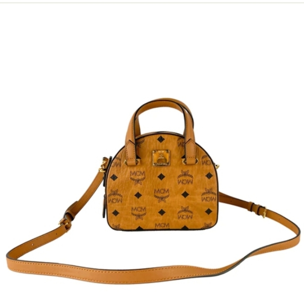 MCM half moon mini tote great condition with normal wears